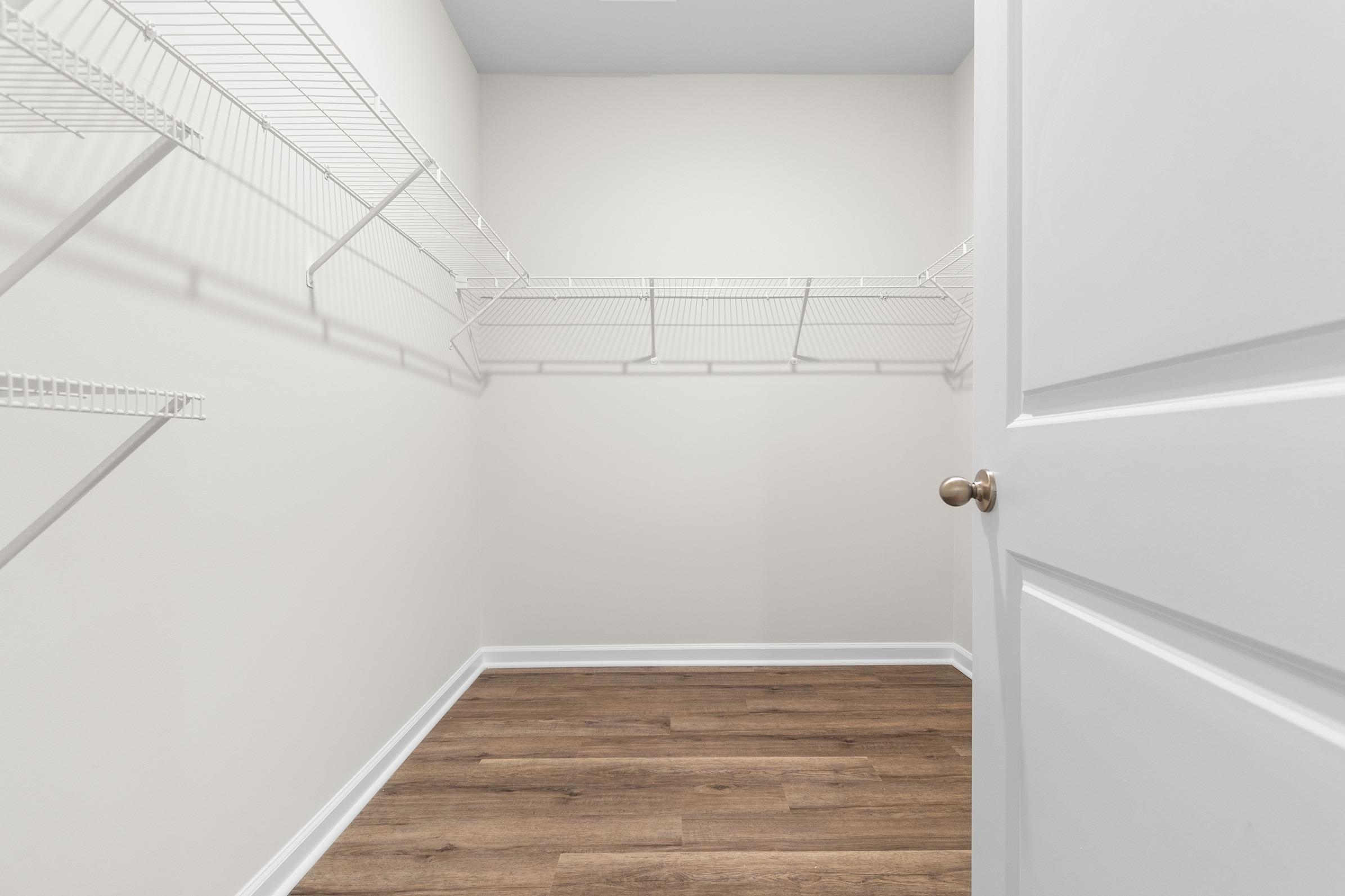 620 Anthem Court Conway, SC 29527 - Photo 18 of 25 Walk in closet featuring wood finished floors
