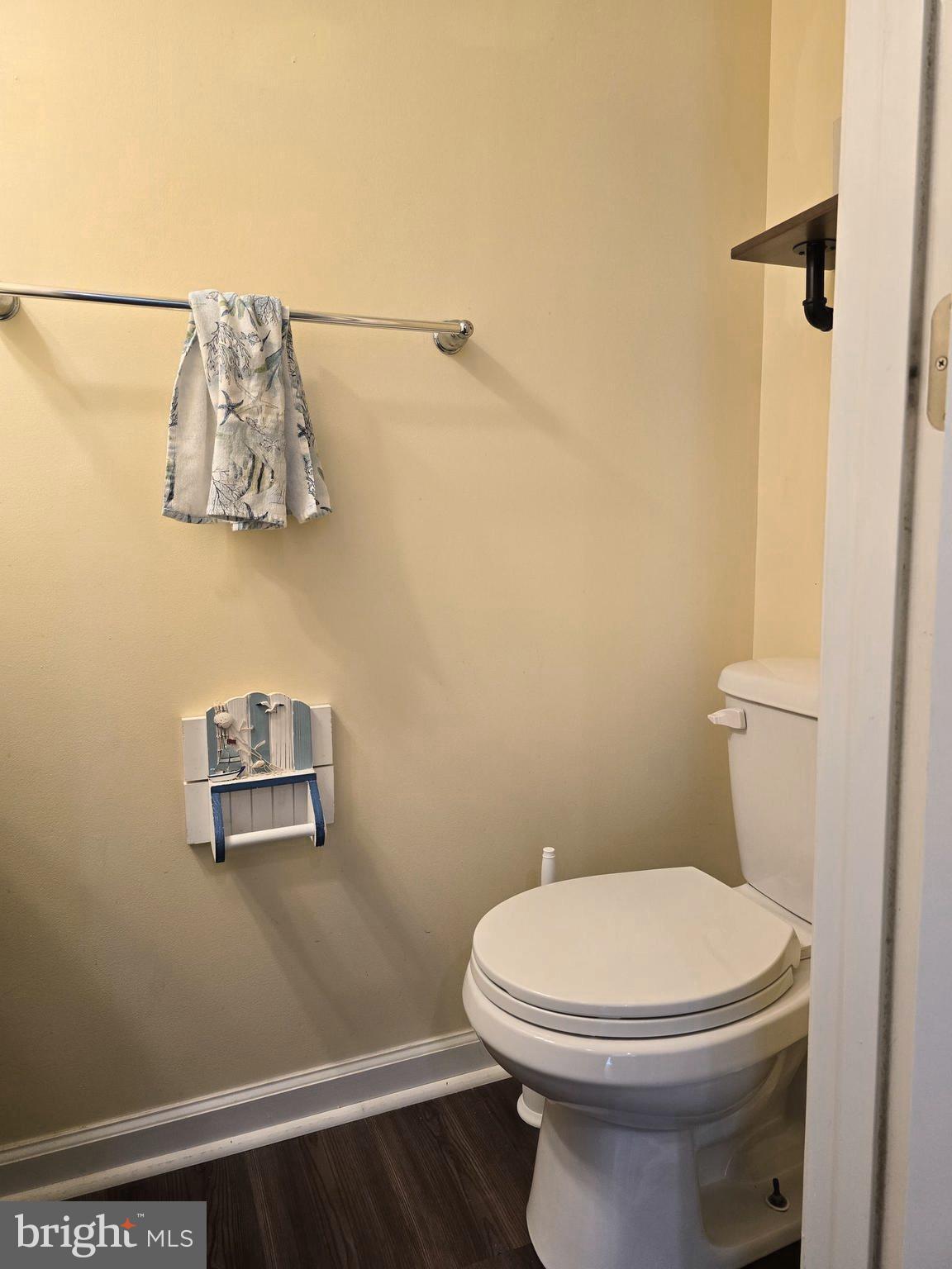 181 Bobbys Branch Road, Unit 35 Millsboro, DE 19966 - Photo 13 of 26 a white toilet sitting next to a shower