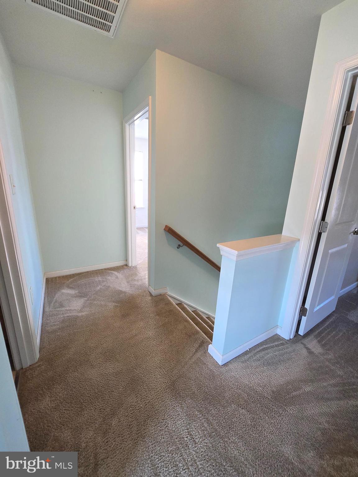 181 Bobbys Branch Road, Unit 35 Millsboro, DE 19966 - Photo 15 of 26 a view of an empty room with stairs