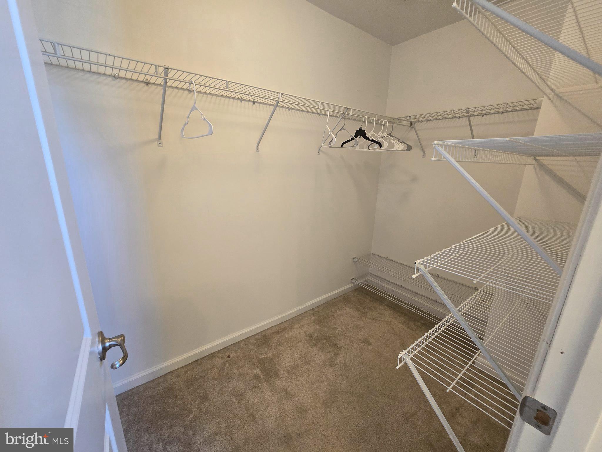 181 Bobbys Branch Road, Unit 35 Millsboro, DE 19966 - Photo 18 of 26 a view of a room with racks on the wall