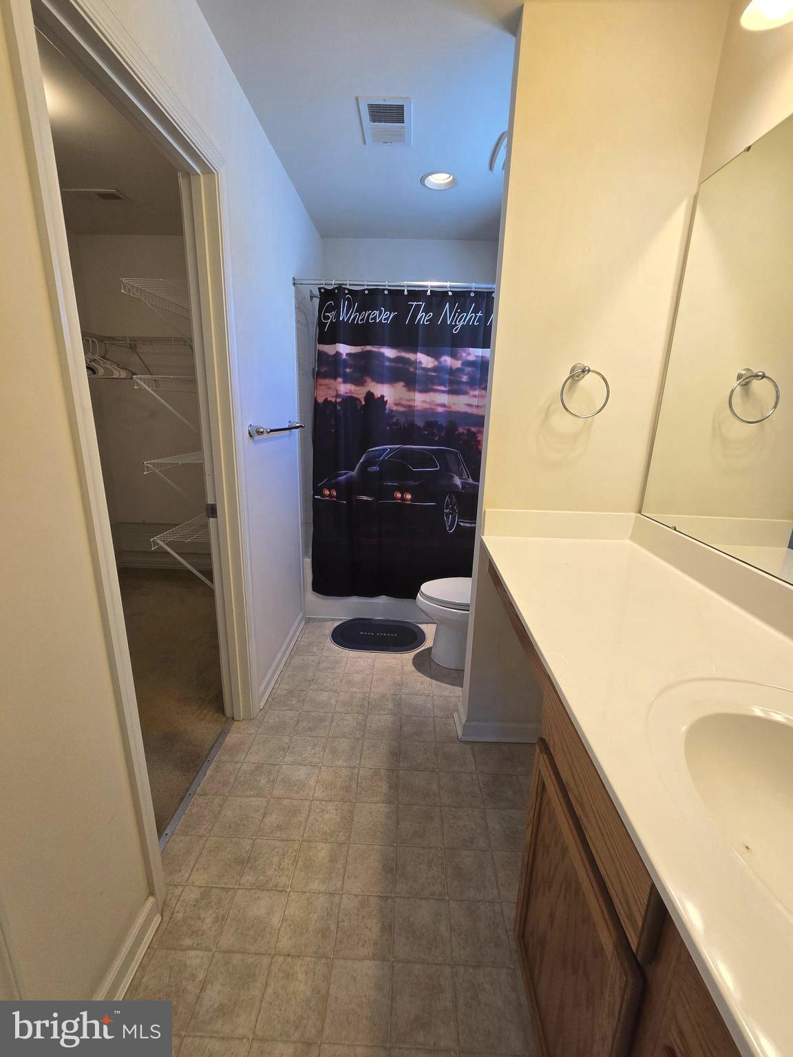 181 Bobbys Branch Road, Unit 35 Millsboro, DE 19966 - Photo 19 of 26 a bathroom with a sink a mirror and a bathtub