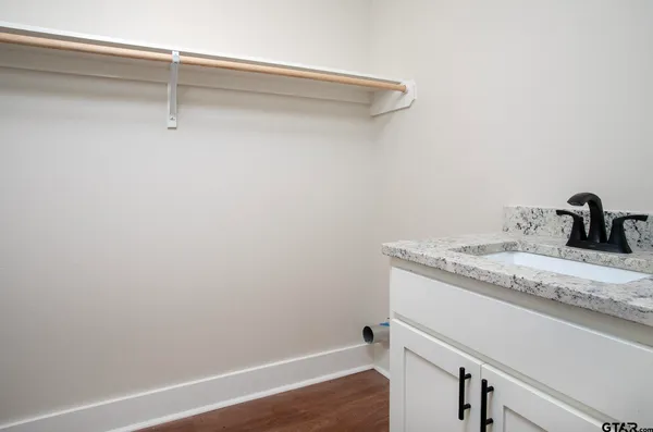 a bathroom with a sink and vanity