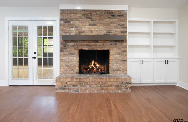 a living room with a fireplace