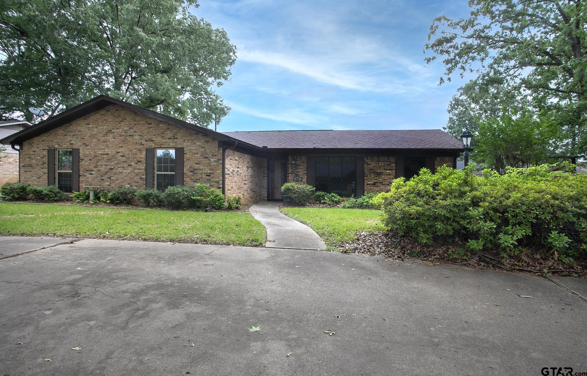 610 Rockwall Drive Longview, TX 75604 - Photo 39 of 39 a view of a house with a yard and large tree