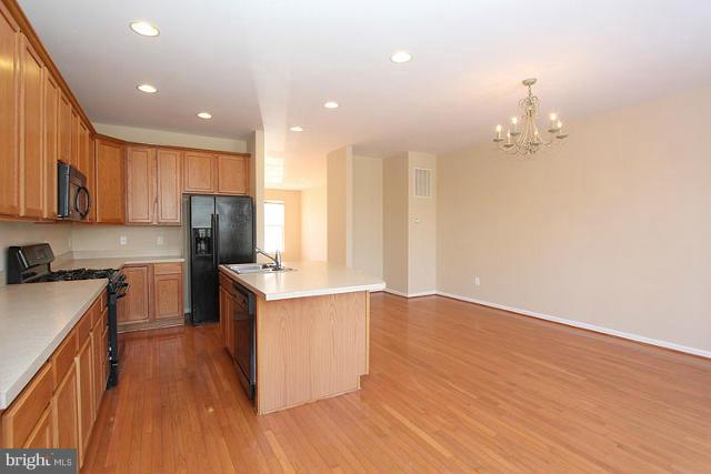 9077 Ribbon Falls Loop Bristow, VA 20136 - Photo 9 of 30 Kitchen- Dining Room