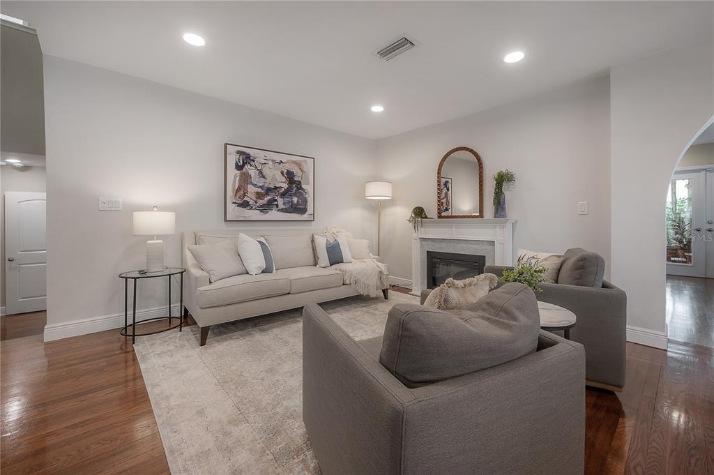 3108 West Villa Rosa Street Tampa, FL 33611 - Photo 7 of 58 a living room with furniture and a fireplace