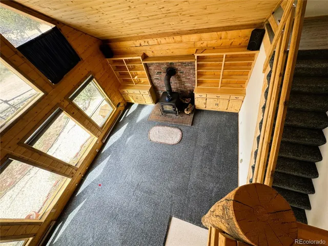 a swimming pool with outdoor seating and a window