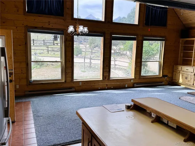 a kitchen with sink a refrigerator and a stove
