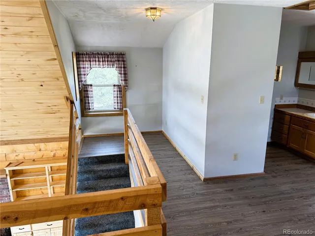 a bathroom with a toilet and a mirror
