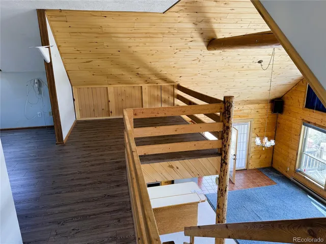 a bathroom with a toilet and a shower curtain
