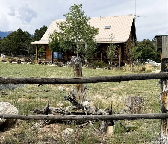 a view of swimming pool with a table and chairs