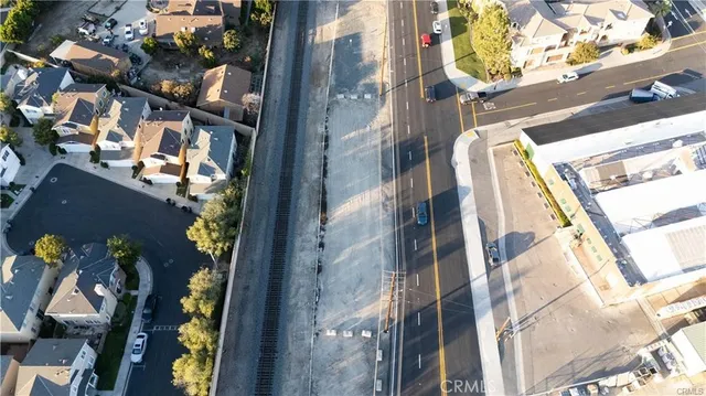 an aerial view of a residential apartment building with a yard