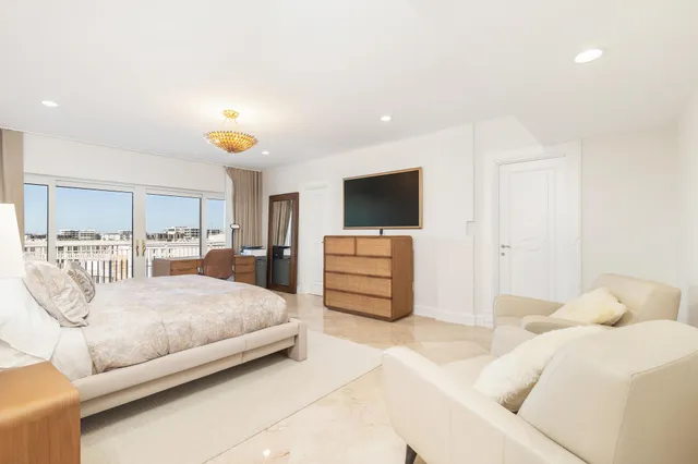 a bedroom with a bed and flat screen tv