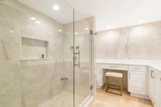 a bathroom with a shower and a sink