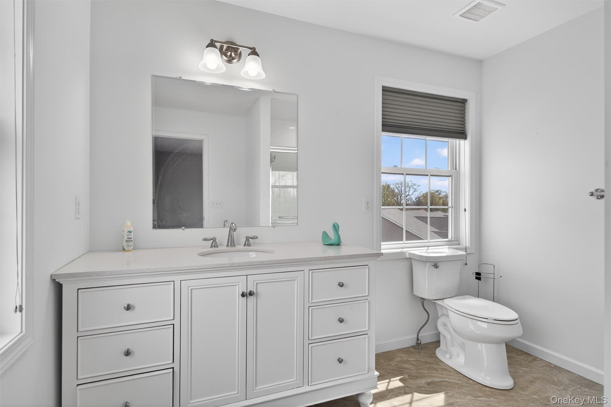 35 Pinto Road Middletown, NY 10941 - Photo 22 of 41 a bathroom with a toilet sink and mirror