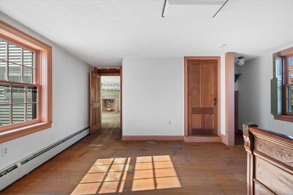 5 Carpenter Hill Road Charlton, MA 01507 - Photo 16 of 42 a view of empty room with windows and wardrobe