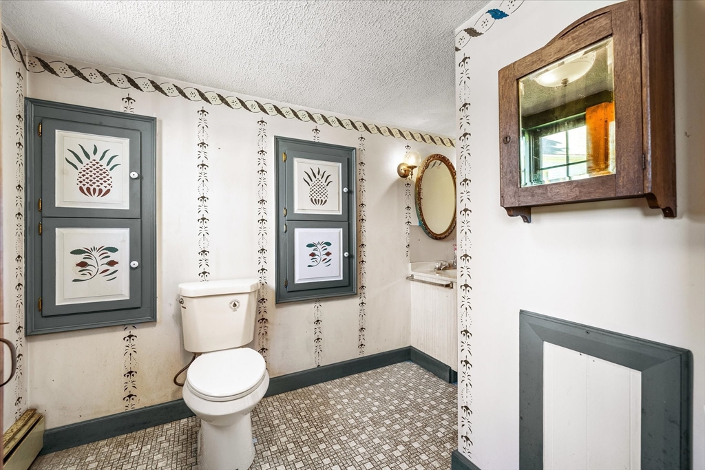 5 Carpenter Hill Road Charlton, MA 01507 - Photo 22 of 42 a bathroom with a toilet sink and mirror
