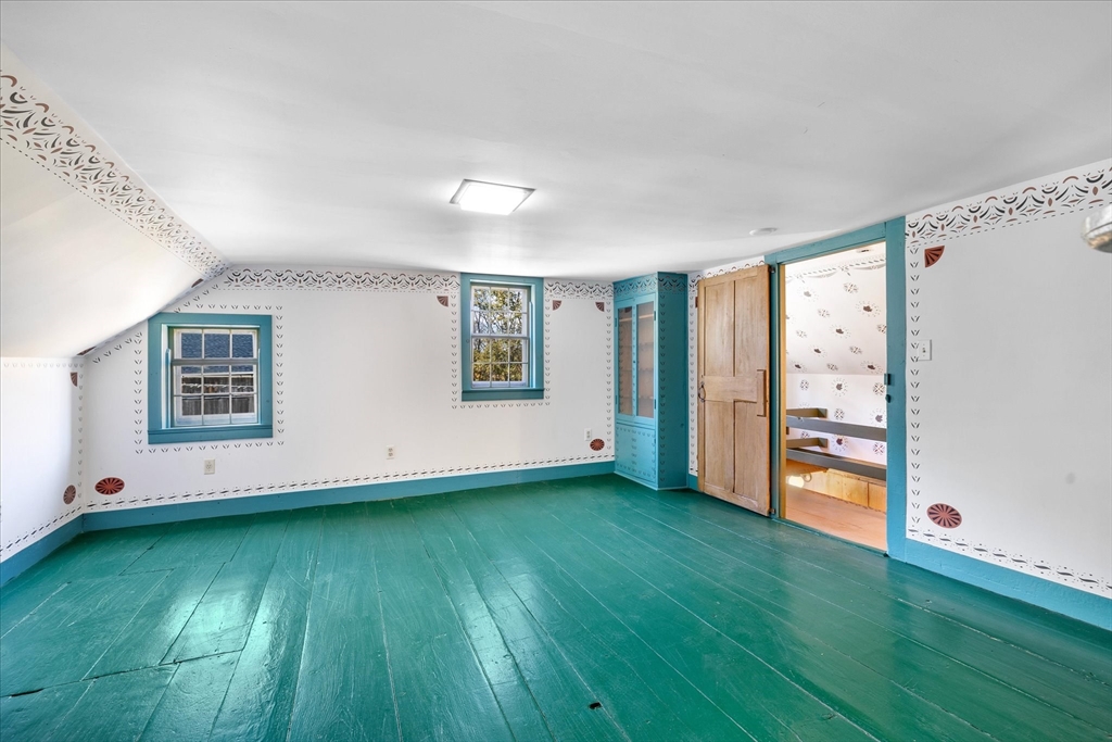 5 Carpenter Hill Road Charlton, MA 01507 - Photo 30 of 42 a view of an empty room with window and wooden floor