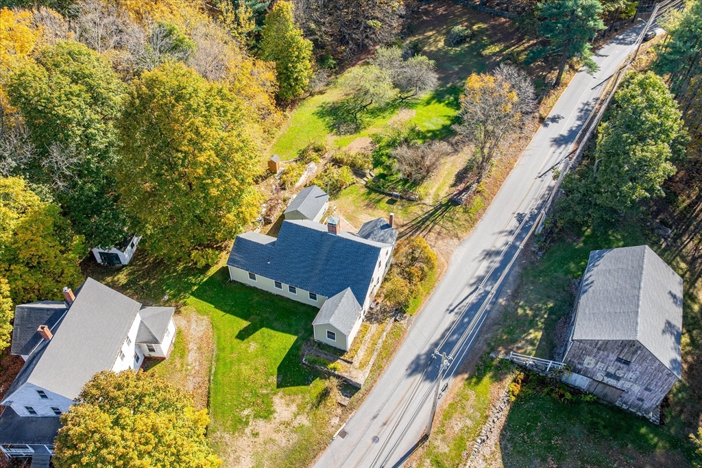 5 Carpenter Hill Road Charlton, MA 01507 - Photo 40 of 42 an aerial view of a house with swimming pool and large trees