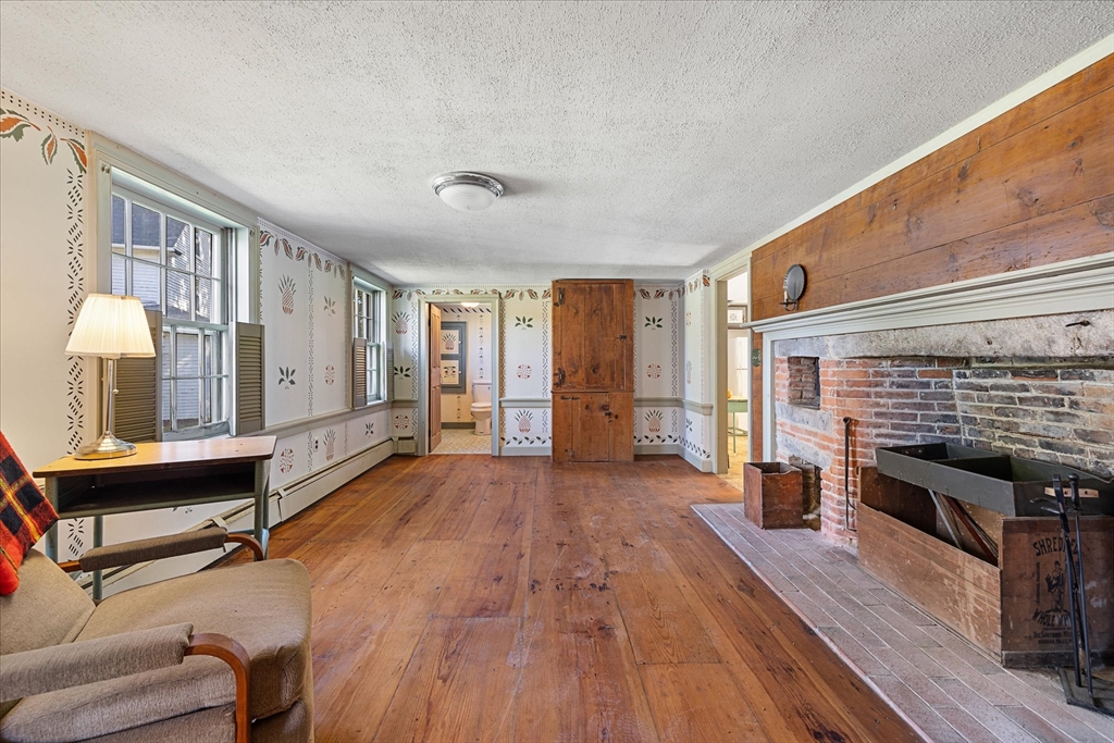 5 Carpenter Hill Road Charlton, MA 01507 - Photo 4 of 42 a view of a livingroom with furniture a fireplace and wooden floor
