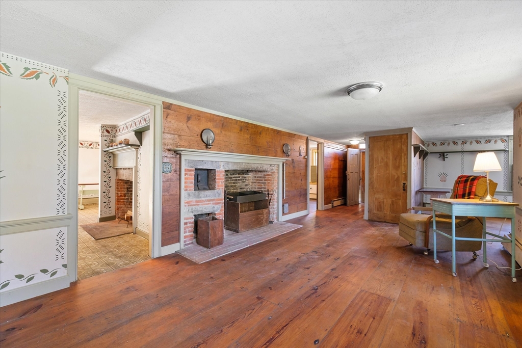 5 Carpenter Hill Road Charlton, MA 01507 - Photo 6 of 42 a view of a livingroom with furniture and a fireplace