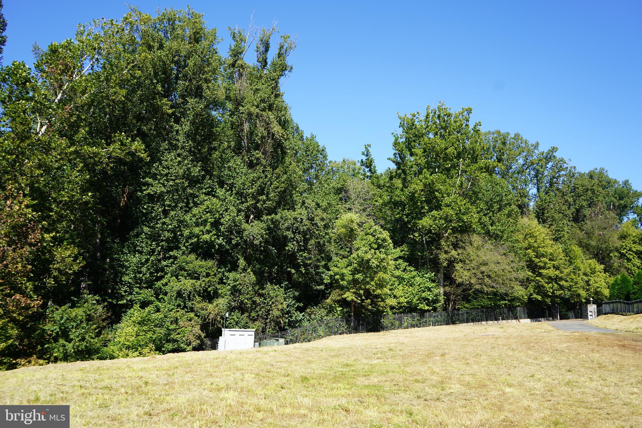 12000 River Road Potomac, MD 20854 - Photo 12 of 13 a view of a yard covered with snow in the background