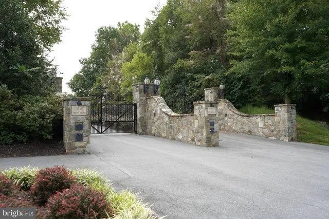 a street view with wooden fence and trees