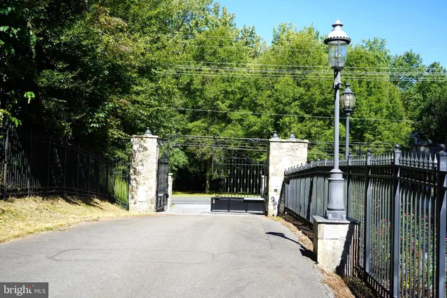 a view of a pathway along the road and trees