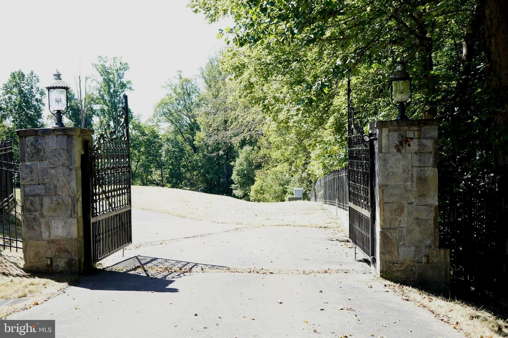12000 River Road Potomac, MD 20854 - Photo 7 of 13 a view of a pathway along the road and trees