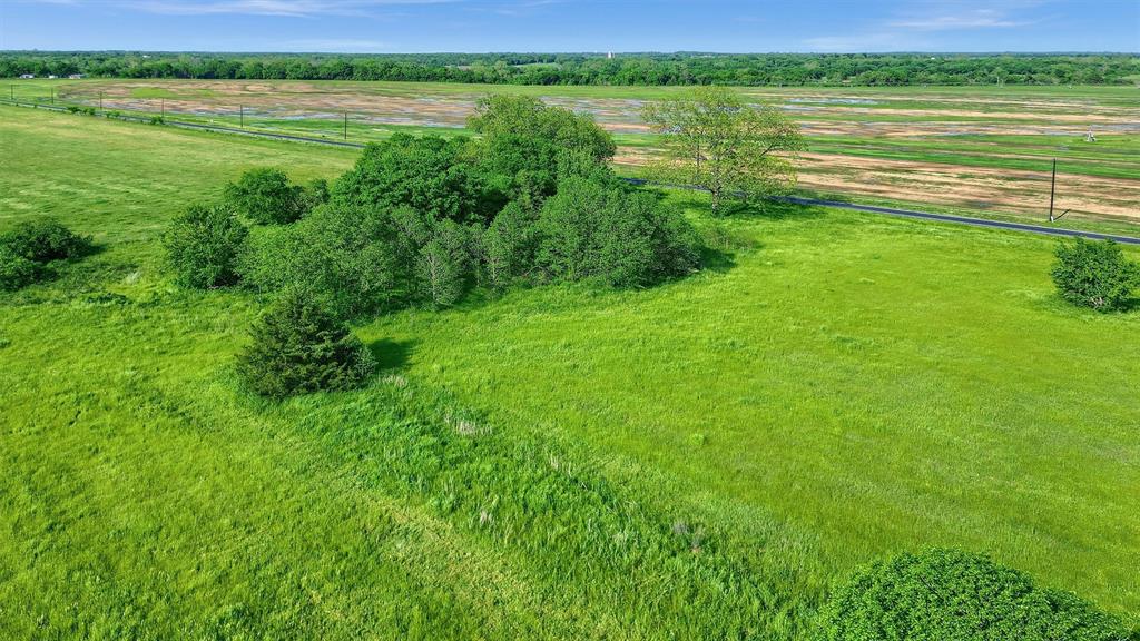 0 Carpenters Bluff Road Bells, TX 75414 - Photo 12 of 17 a view of a lake with a yard and large trees