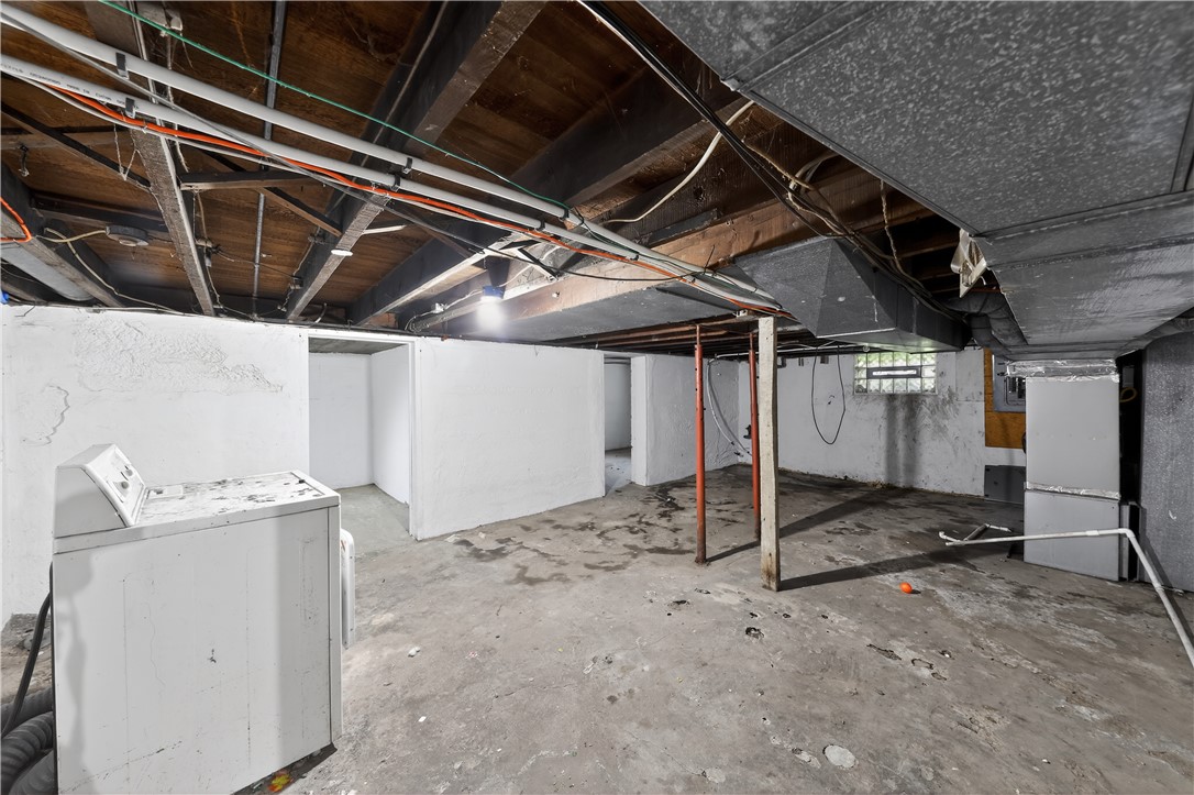 205 Rita Street Dayton, OH 45404 - Photo 26 of 34 This spacious unfinished basement offers ample potential for customization and additional living space.