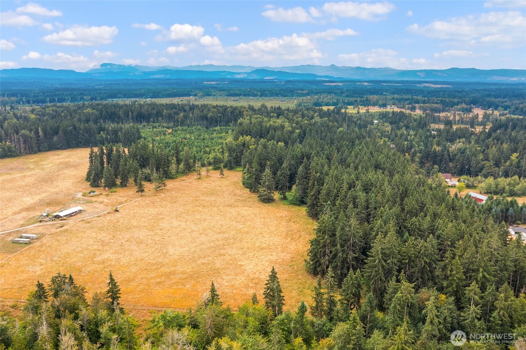 1716 304th Street East Roy, WA 98580 - Photo 12 of 21 a view of a lake with a city