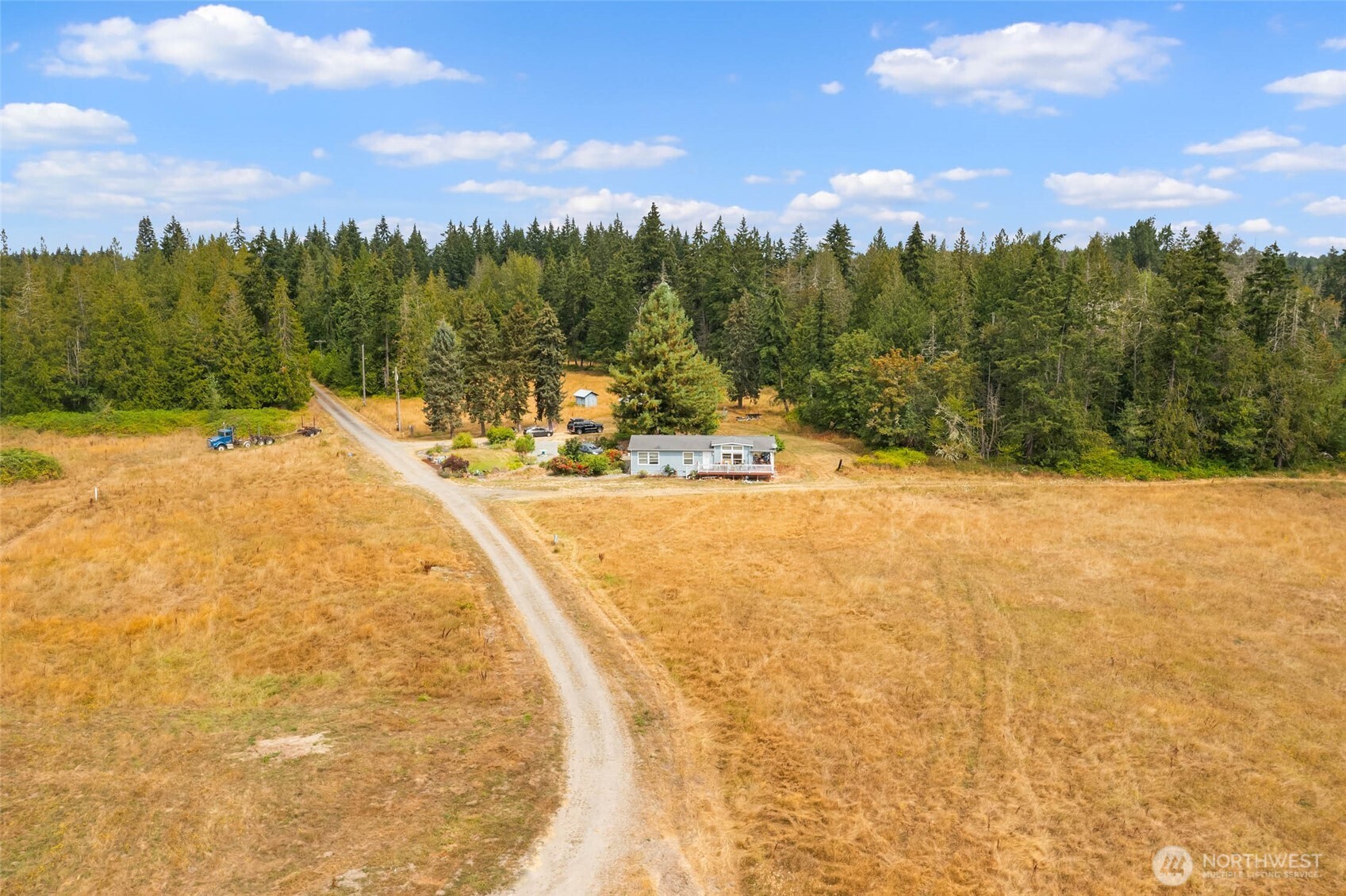 1716 304th Street East Roy, WA 98580 - Photo 18 of 21 a view of swimming pool with a yard