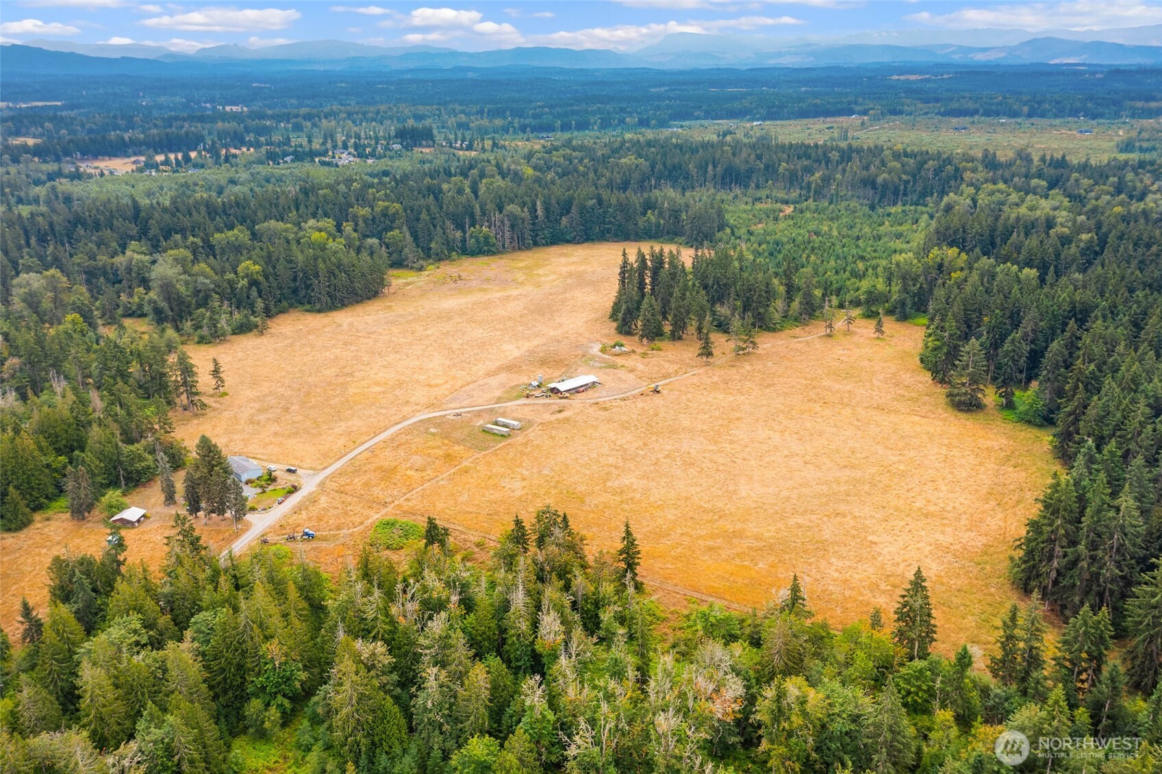 1716 304th Street East Roy, WA 98580 - Photo 10 of 21 a view of a lake with a yard