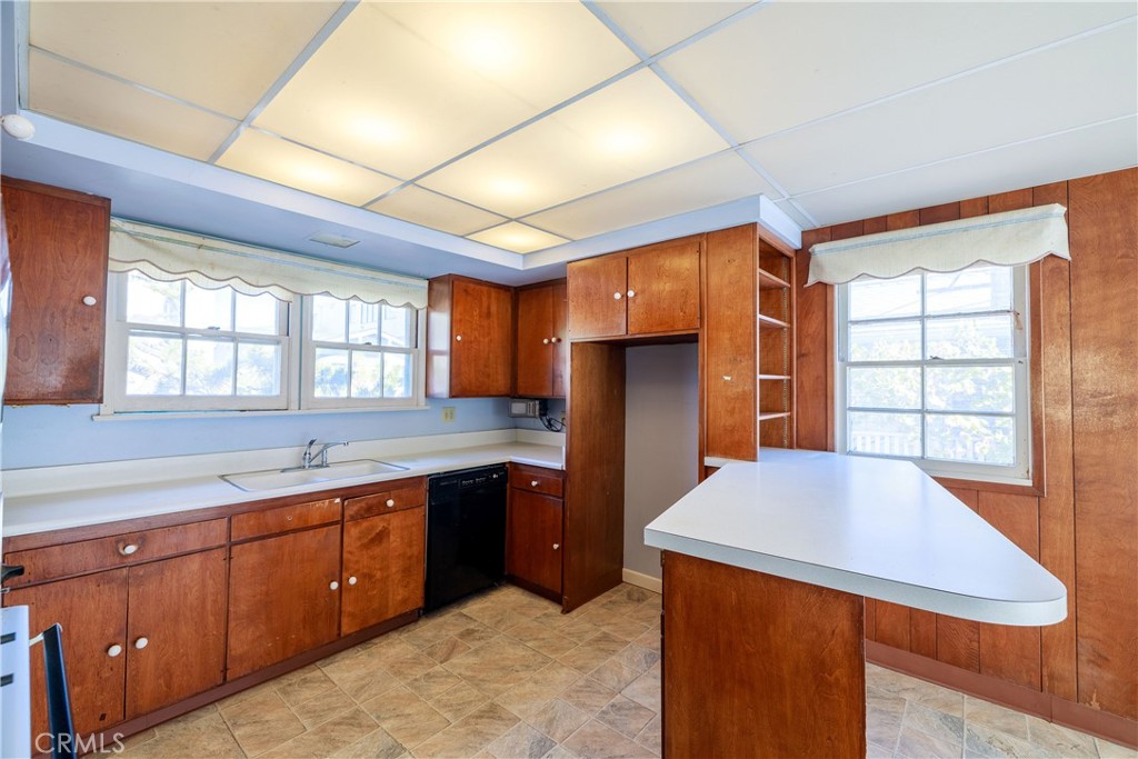 400 5th Street Manhattan Beach, CA 90266 - Photo 12 of 22 a large kitchen with stainless steel appliances granite countertop a sink and a refrigerator