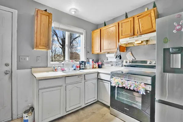 a kitchen with sink cabinets and outdoor view
