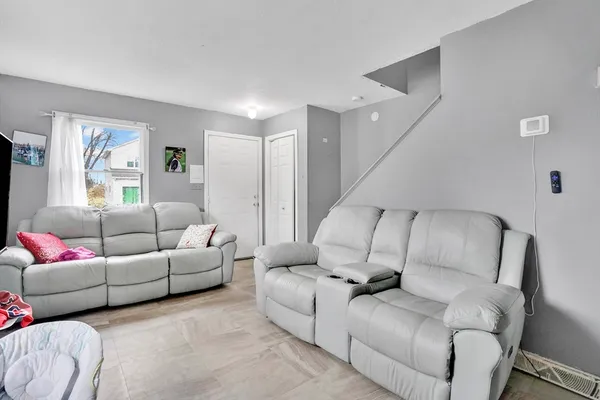 a living room with furniture and a couch