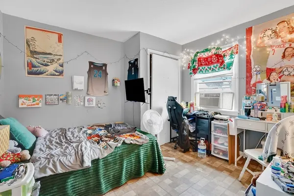a bedroom with furniture and a bed
