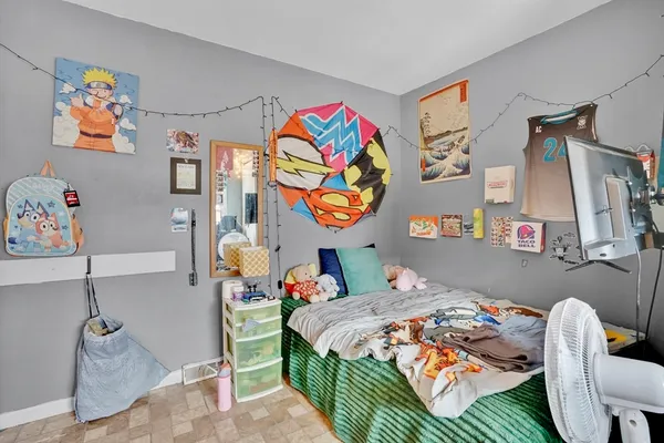 a bedroom with a bed and furniture
