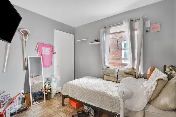 a bedroom with a bed and furniture