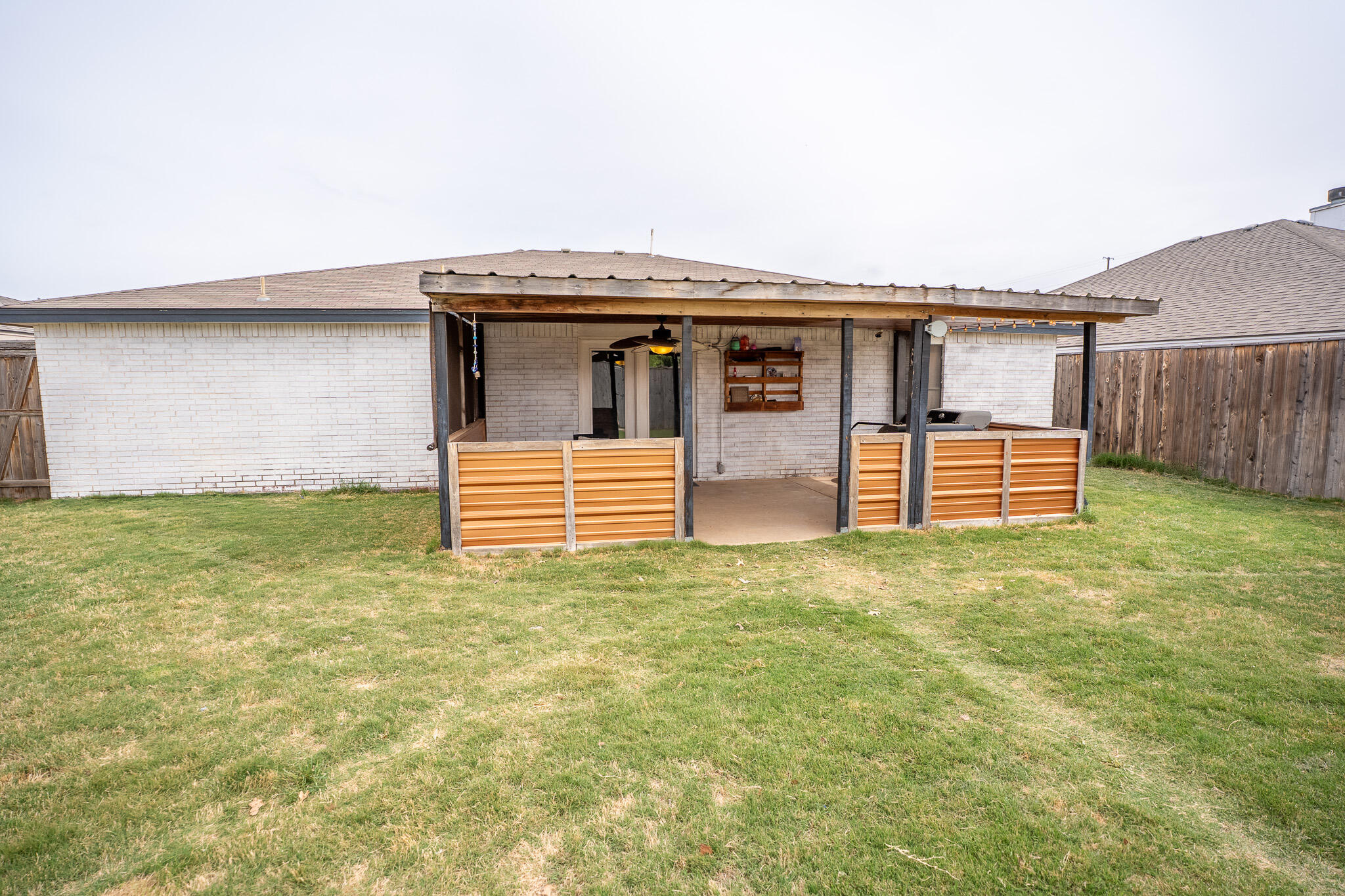 1609 78th Street Lubbock, TX 79423 - Photo 34 of 36 a front view of a house with garden