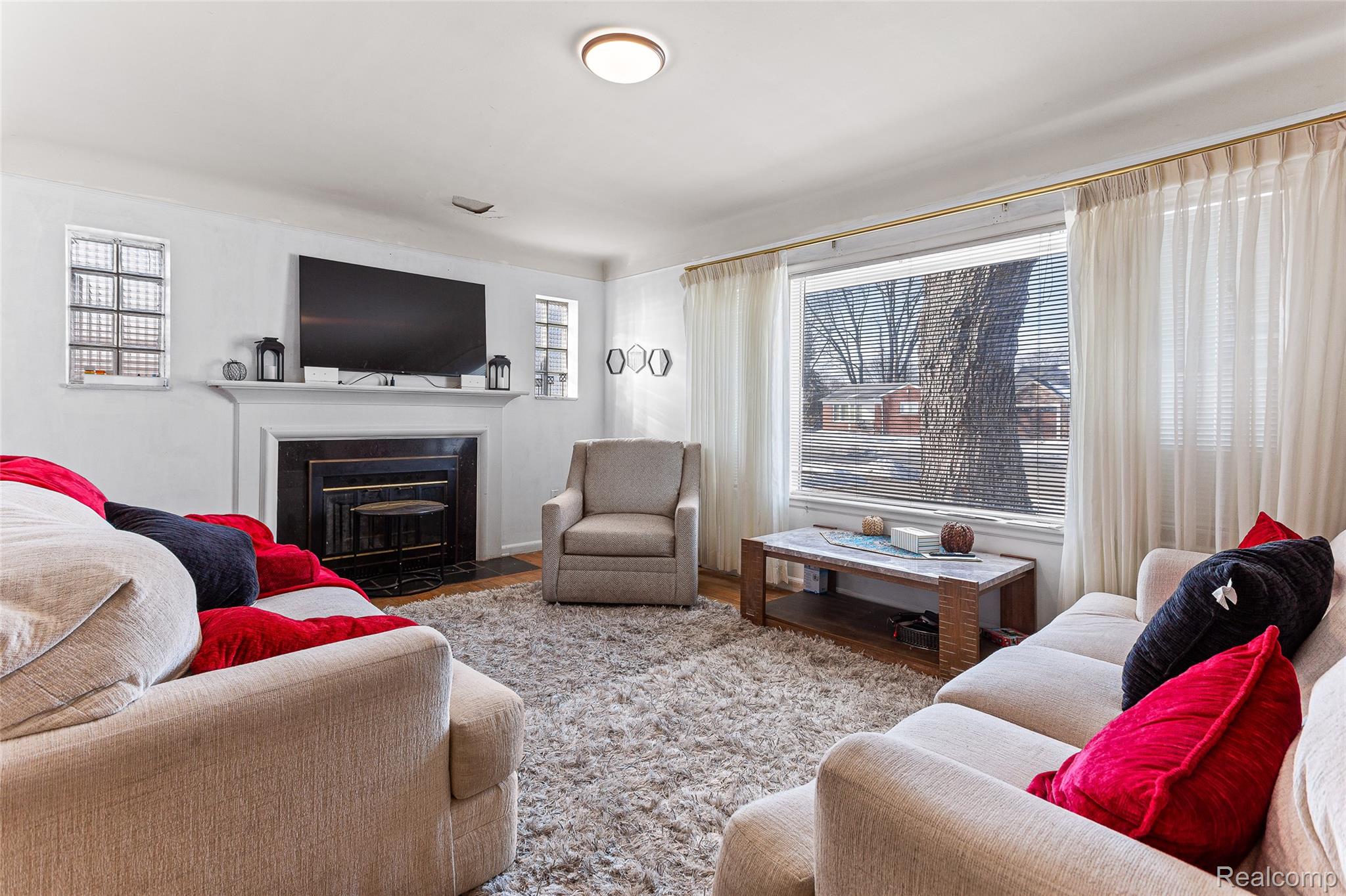 1830 North Gulley Road Dearborn, MI 48128 - Photo 21 of 29 Living area with a fireplace with flush hearth