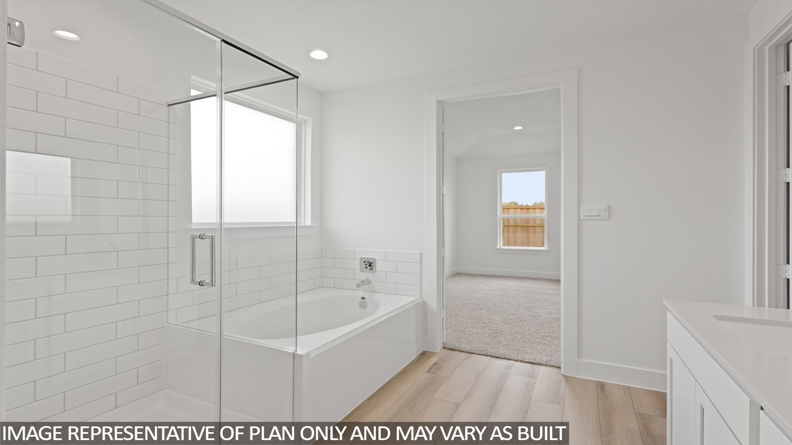 4613 Vernal Loop Conroe, TX 77303 - Photo 15 of 35 a bathroom with a bathtub and shower