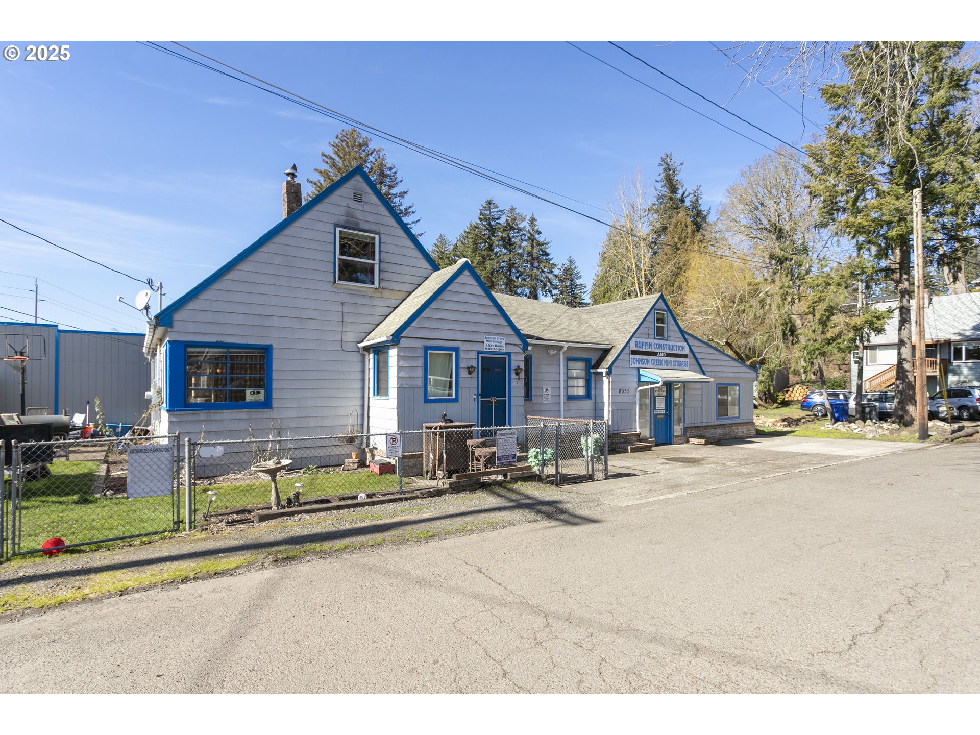 8935 Southeast Stanley Place Portland, OR 97206 - Photo 1 of 43 a view of a house with wooden fence