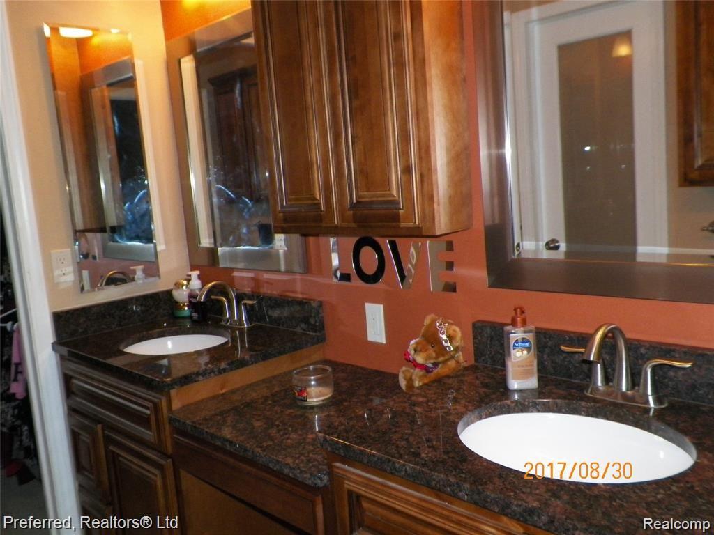 6001 Pheasant Run Canton, MI 48187 - Photo 17 of 29 Double Vanity granite surface @ en suite