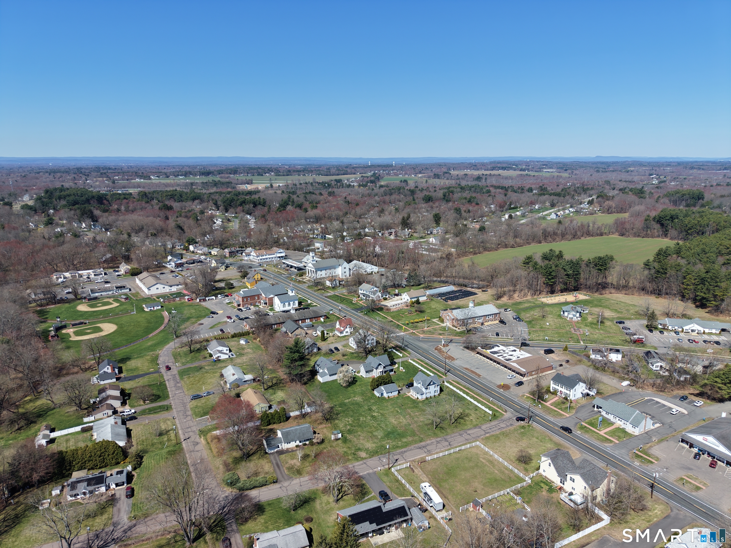 616 Main Street Somers, CT 06071 - Photo 20 of 24 an aerial view of a city with lots of residential buildings