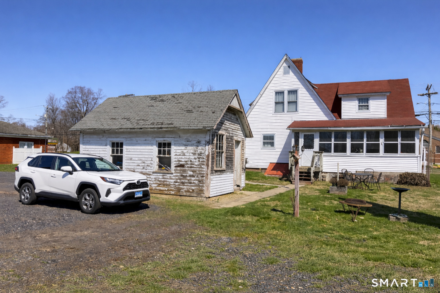 616 Main Street Somers, CT 06071 - Photo 3 of 24 a front view of a house with parking space