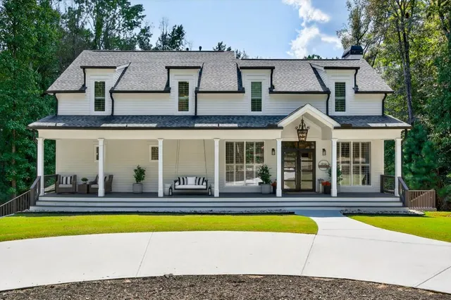a front view of a house with a large window