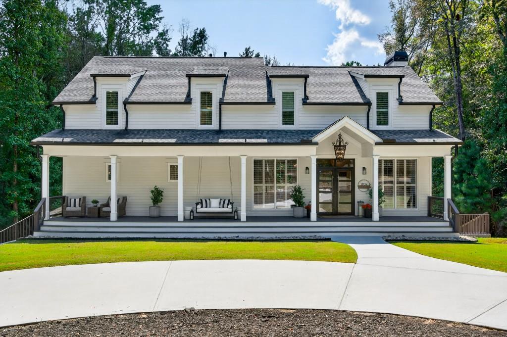 4275 Habersham Way Cumming, GA 30041 - Photo 1 of 34 a front view of house with a yard outdoor seating and yard