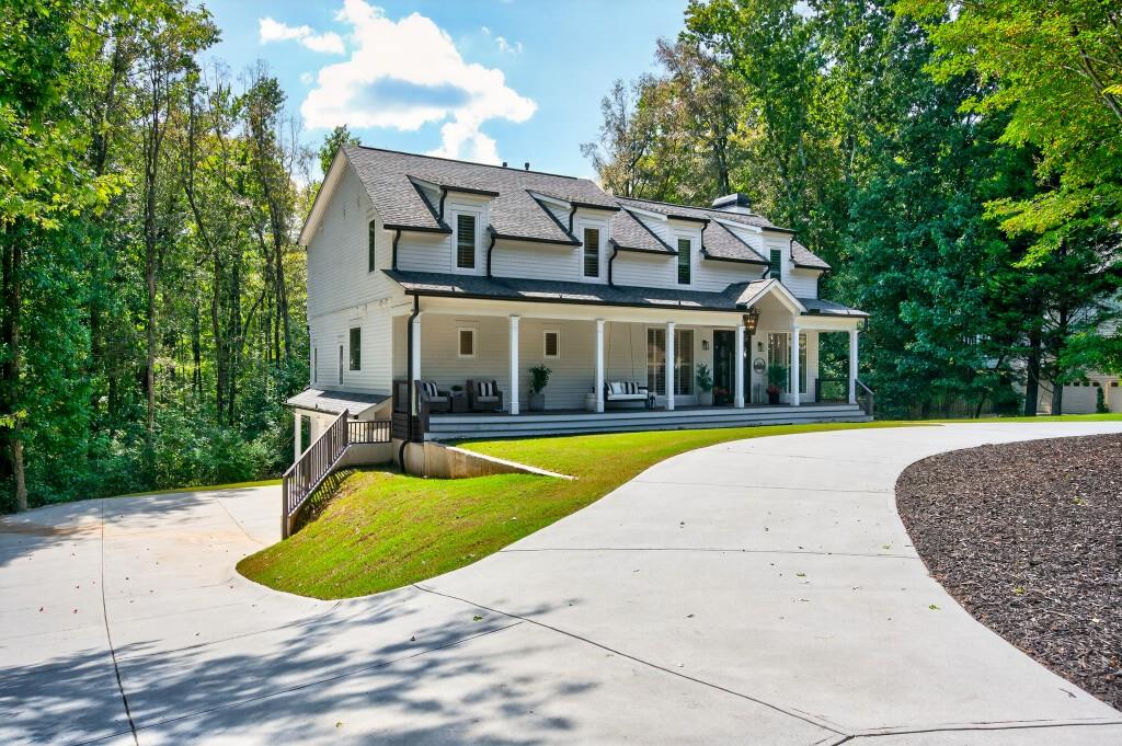 4275 Habersham Way Cumming, GA 30041 - Photo 2 of 34 a view of a house with swimming pool
